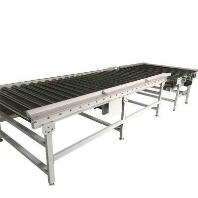 China UC-103 Series Heat Resistant Live Roller Conveyor Driven with Heavy Duty Adjustable Feet for sale