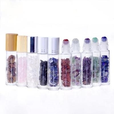 China Personal Care Cosmetic Packaging Roll Glass Crystal Bottle With Stones For Oil for sale