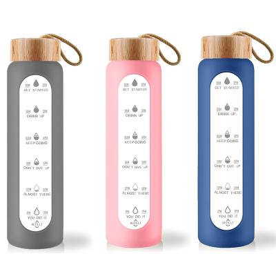 China 2022 Customs Sustainable Water Bottle With Silicone Sleeve Bamboo Lid Borosilicate Glass Water Bottle Leakproof Reusable Stamp for sale