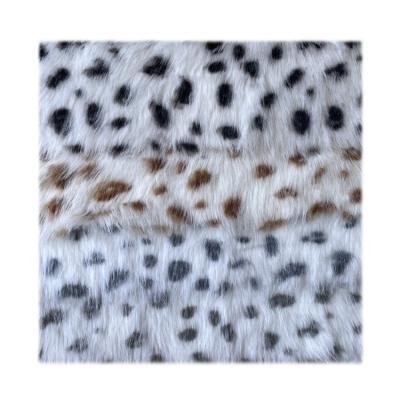 China Auto upholstery printed leopard faux wool fur wholesale 100 polyester faux sheepskin curly lamb fur fabric for sale