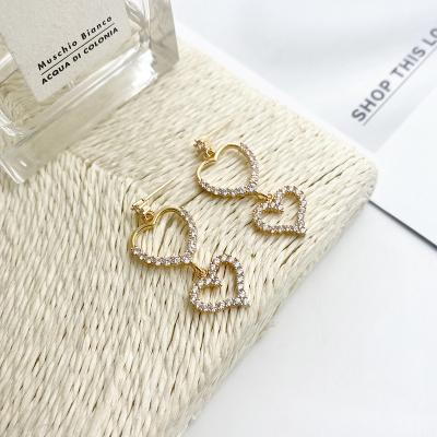 China FASHIONABLE Unique Candy Heart Hollow Earrings and Beautiful Tassel Zircon Heart Earrings New Long For Women for sale