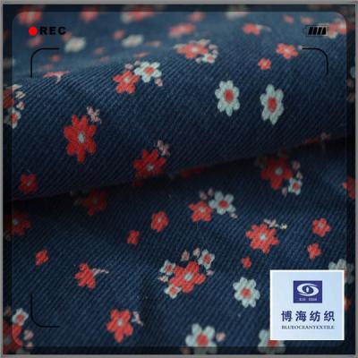 China Small sunflower print corduroy blazer fabric baby wale corduroy fabric anti-static for sale