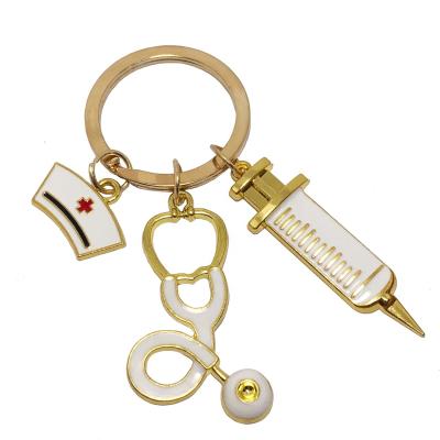 China Custom Creative Nurse Stethoscope Holder Key Syringe Souvenir Medical Staff Europe Metal Key Chain for sale