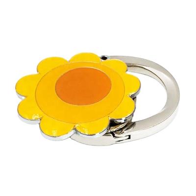 China Europe factory direct sale metal sunflower table top bag hanger printing logo purse key holder gifts and crafts for sale