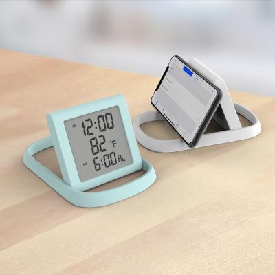 China Files Multi Function Customized LCD Display Digital Table Clock With Cell Phone Holder For Home Business for sale