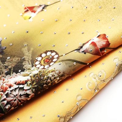 China Tear-Resistant European Style Gemstone Print Flower Woven Fabric African Spandex With Stone for sale