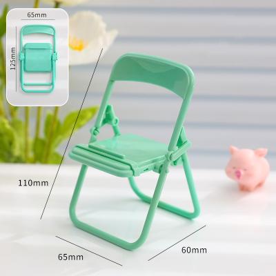 China Creative Universal Desktop Mobile Phone Holder Live Watch Tv Lazy Chasing Small Chair Adjustable Mobile Phone Holder for sale