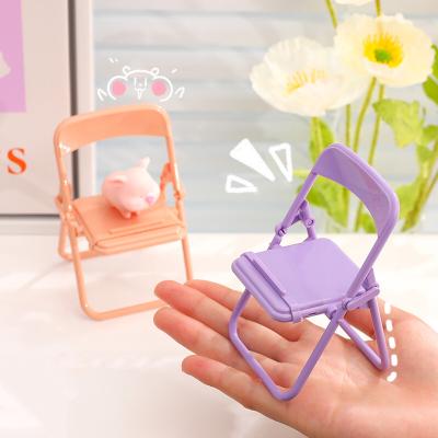 China Adjustable Cute Chair Form Adjustable Foldable Portable Plastic Cell Phone Display Stand For Watching TV Phone Stand Lazy Bracket for sale