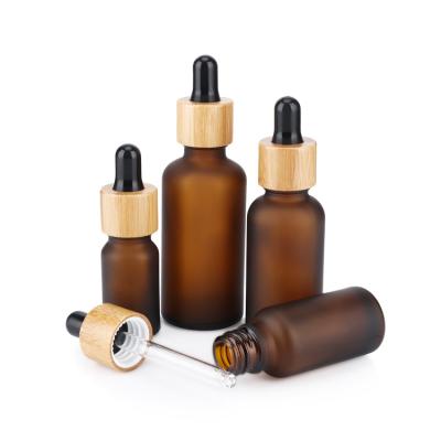 China New Arrival Cosmetic Custom Wholesale Frosted 30ml Amber Glass Essential Oil Dropper Bottle With Bamboo Collar for sale