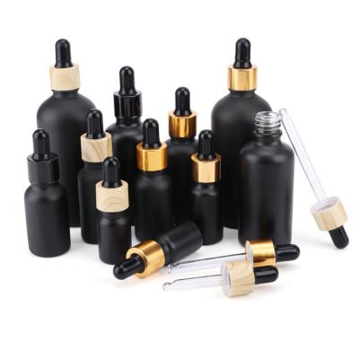 China Matte Frosted Black Bottle Essential Luxury Clear Empty Cosmetic Oil Serum Glass Dropper Bottle for sale