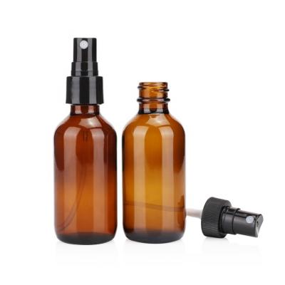 China High Quality Wholesale Cosmetic Essential Oil 2oz 60ml Amber Color Round Glass Boston Packing Bottle With Spray Cap for sale