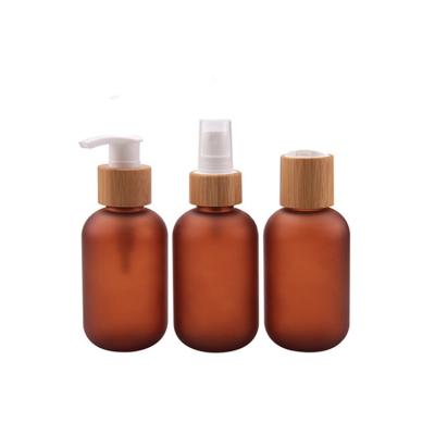 China Personal Care OEM Customize Size Hotel Liquid Soap Dispenser Hand Wash Liquor Bottle Pump Amber Glass Essential Oil Bottle With Bamboo Cap for sale