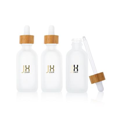 China Cosmetic Bamboo Cosmetic Packing15ml 30ml 100ml Frosted Green Cosmetic Essential Oil Dropper Packing Glass Bottle With Bamboo Lid for sale