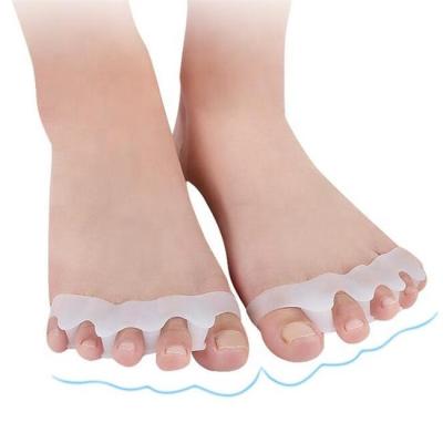 China New Silicone 4 Holes Foot Care Finger Hammer Toe Separator Hammer Toe Hallux Valgus Corrector for sale