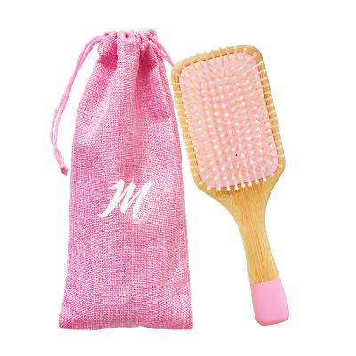 China Nondisposable Well-designed Hot Selling Pink Bamboo Detangling Massage Scalp Hair Brush For Home Use for sale