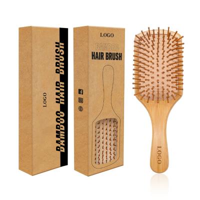 China Cushion Wholesale Customize Logo Detangling Massage Wooden Bamboo Paddle Hair Brush for sale