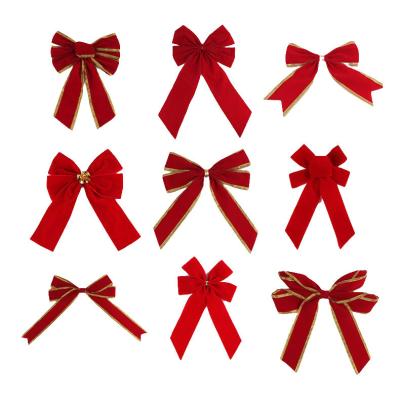 China 2023 Hot Selling 100% Polyester Cable Edge Christmas Snowflake Bows Large 26*32cm Christmas Bows Grig Tie For Decoration for sale