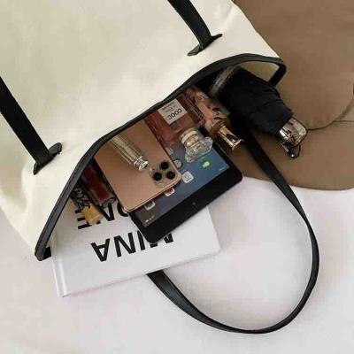 China Large capacity wholesales custom canvas handbag large capacity women's fashion women's shopping bag simple packaging bag for sale