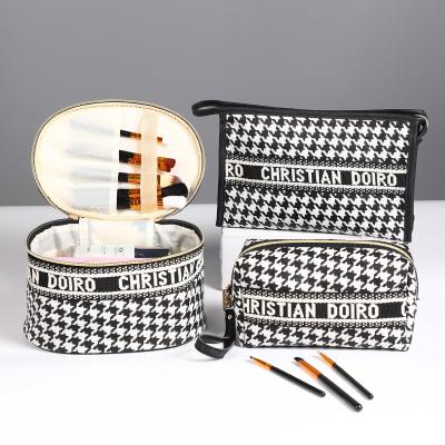 China Customized Makeup Bag Vertical Square Houndstooth PU Leather Travel Waterproof Toiletry Cosmetic Bag for sale