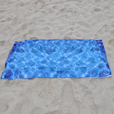 China Luxury Anti Stock Compressed Multifunctional Spell Microfiber Cheap Sand Beach Bath Towel for sale