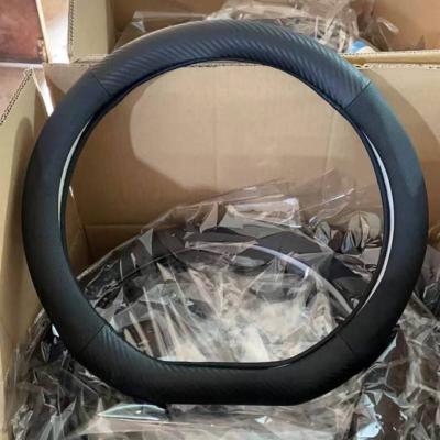 China Sports Universal Car Leather Universal Car Four Seasons Carbon Fiber Breathable Durable Steering Wheel Cover for sale