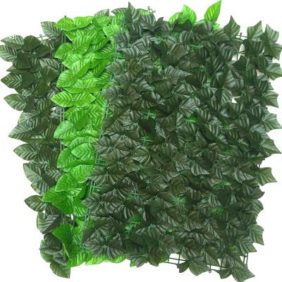 China Minimalist UV Protective Artificial Greenery Plant Shed Plant Grass Wall Board Boxwood Hanging Fence for Garden for sale