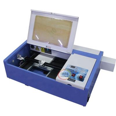 China Laser CUTTING Best Price Small Size 30cm*20cm Mini Co 2 Laser Engraving Cutting Machine For Seals And Stamps for sale