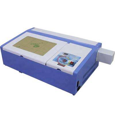 China Mini Rubber Making Machine Cheap Price Laser CUT 40W 50W Desktop CO2 Laser Stamp Engraver for sale