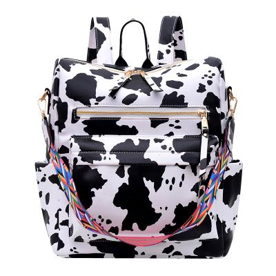 China Amazon Anti-theft Hot Cow Print Animal Print Backpack Personalized Faux Monogram Leather Vegan Outdoor Backpacks for sale