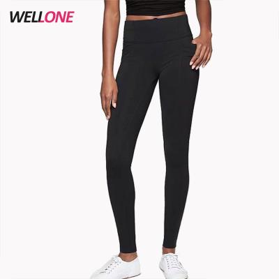 China Guangzhou factory anti-pilling sports gym smooth stretch spandex skinny black leggings for women pockets for sale