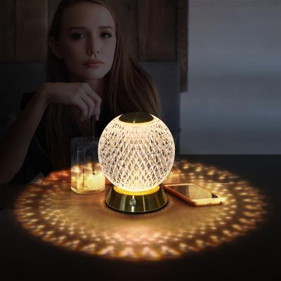 China Adjustable Atmosphere Table Lamp Metal Base Luxury Crystal Filling Night Lamp for sale