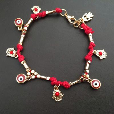 China FASHIONABLE Hot Selling Red Palm Eye Handmade Knitting Bracelets With Charms Gold Plated Bangles for sale