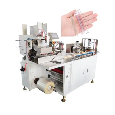 China BOPP Single Side Heat Seal Roll Film Automatic Counting Packing Machine For Nail Clippers for sale