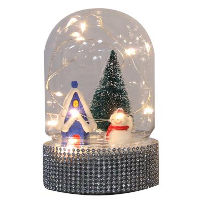 China New Product 10L warm white LED copper wire string light glass dome cloche with snowman and Christmas tree for sale