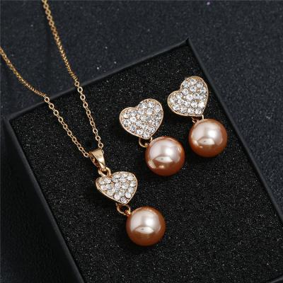 China Romantic Hot Selling Love Rhinestone Pearl Necklace Gold Bridal Jewelry Set Of Earrings For Women for sale