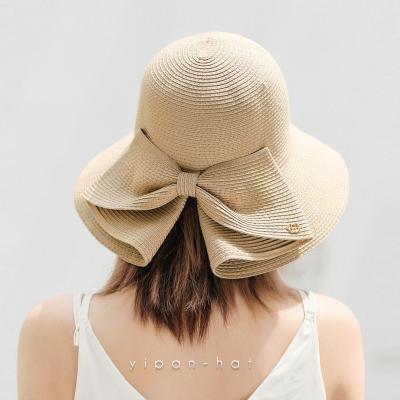 China Foldable Wide Brim Straw Beach Sun Hat Summer Soft Hat With Bowknot For Women Girls for sale