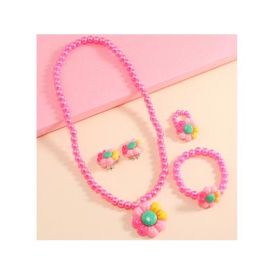 China New Cute Cute Girl Flower Pendant Jewelry Set Cartoon Beaded Necklace Pearl Bracelet Ear Clip Ring Set for sale