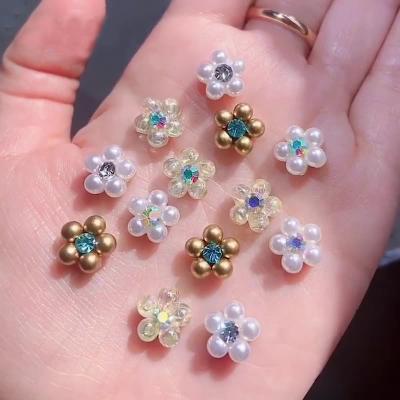 China Easy Apply 2022 New Pearl Flower Diamond Alloy Ornament Internet Celebrity Flat Bottom Color Magic Pearl White Nail Ornament for sale