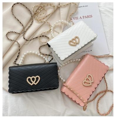 China New all-match bag 2022 small square fashion pearl chain decoration popular women cute sweet messenger bag for sale