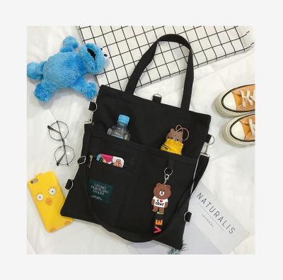 China New female children's primary school students fashion canvas large-capacity universal bag high school oblique cross for sale