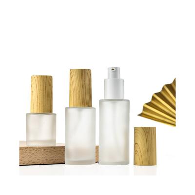 China Personal Care Clear bamboo bottles bamboo lid borosilicate glass bottle plastic bottles 100 ml bamboo spray top for sale