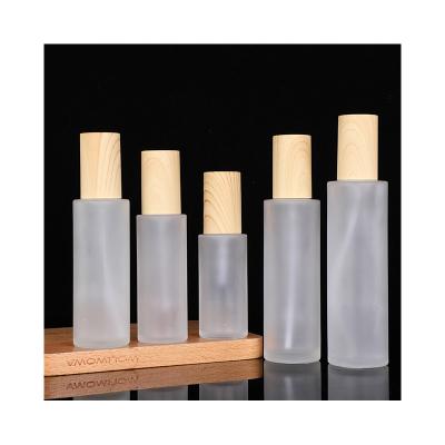 China Personal Care Matte Pressing Pump Round Transparent bamboo dropper bottle bamboo cosmetic bottle for sale