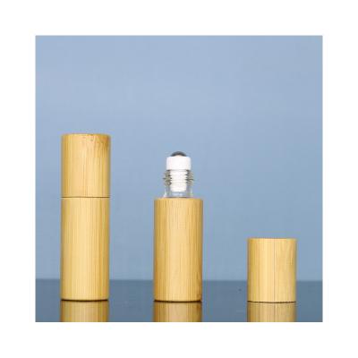 China Cosmetic Bamboo roll on glass bottle empty luxury roll on perfume bottle with stainless steel roller ball for sale