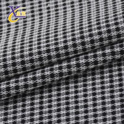 China Excellent viable knitted black white houndstooth plaid jacquard 97% polyester 3% spandex stretch fabric for costume for sale