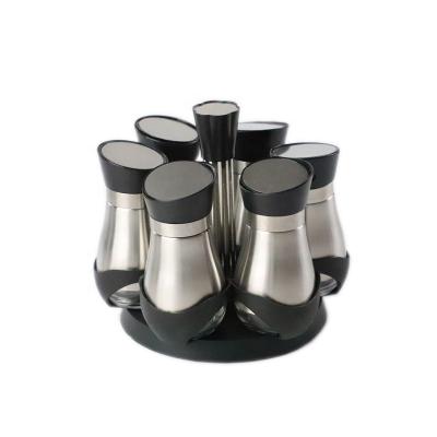 China Sustainable Wholesale Mini Glass Spice Jar Set With Metal Sleeve And Rotating Spice Rack for sale