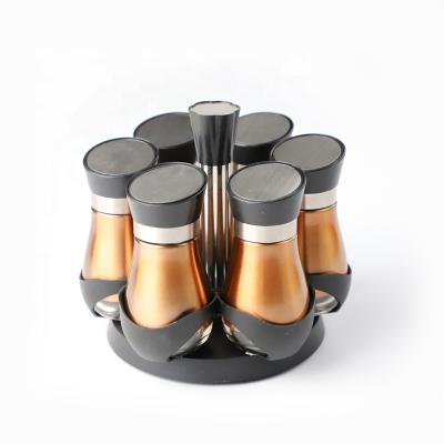 China Sustainable Wholesale Mini Glass Spice Jar Set With Metal Sleeve And Rotating Spice Rack for sale