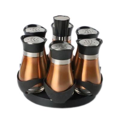 China Sustainable Wholesale Mini Glass Spice Jar Set With Metal Sleeve And Rotating Spice Rack for sale