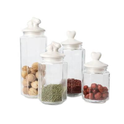 China Sustainable Wholesale Price Glass Candy Jars Different Sizes With Animal Shape Ceramic Lid for sale