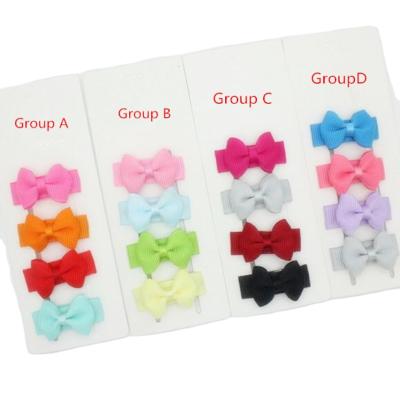 China Popular Newborn Baby Snap Hair Clips Tiny Bow Non Slip Barrettes for Infant Thin Hair Mini Bow Girl for sale