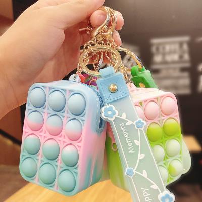 China 2021 New Eco-friendly Squeeze Bubble Fun Fingertip Decompression Silicone Key Chain Sensory Bag Charm Key Chain Key Small Toy Gift for sale